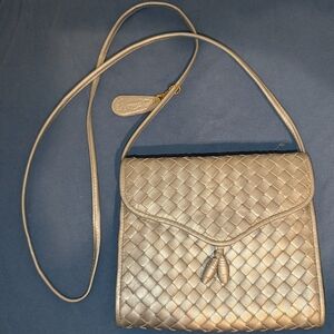 Braided Metallic Silver Crossbody Bag with Tassel Accent By Aspects